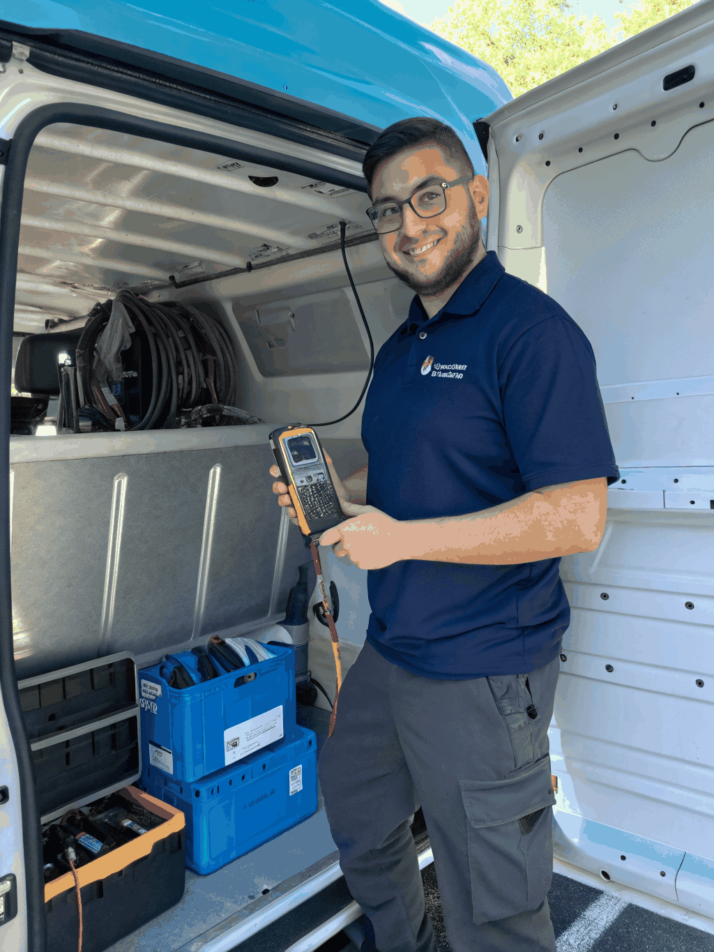 Technician performing maintenance on an AC unit